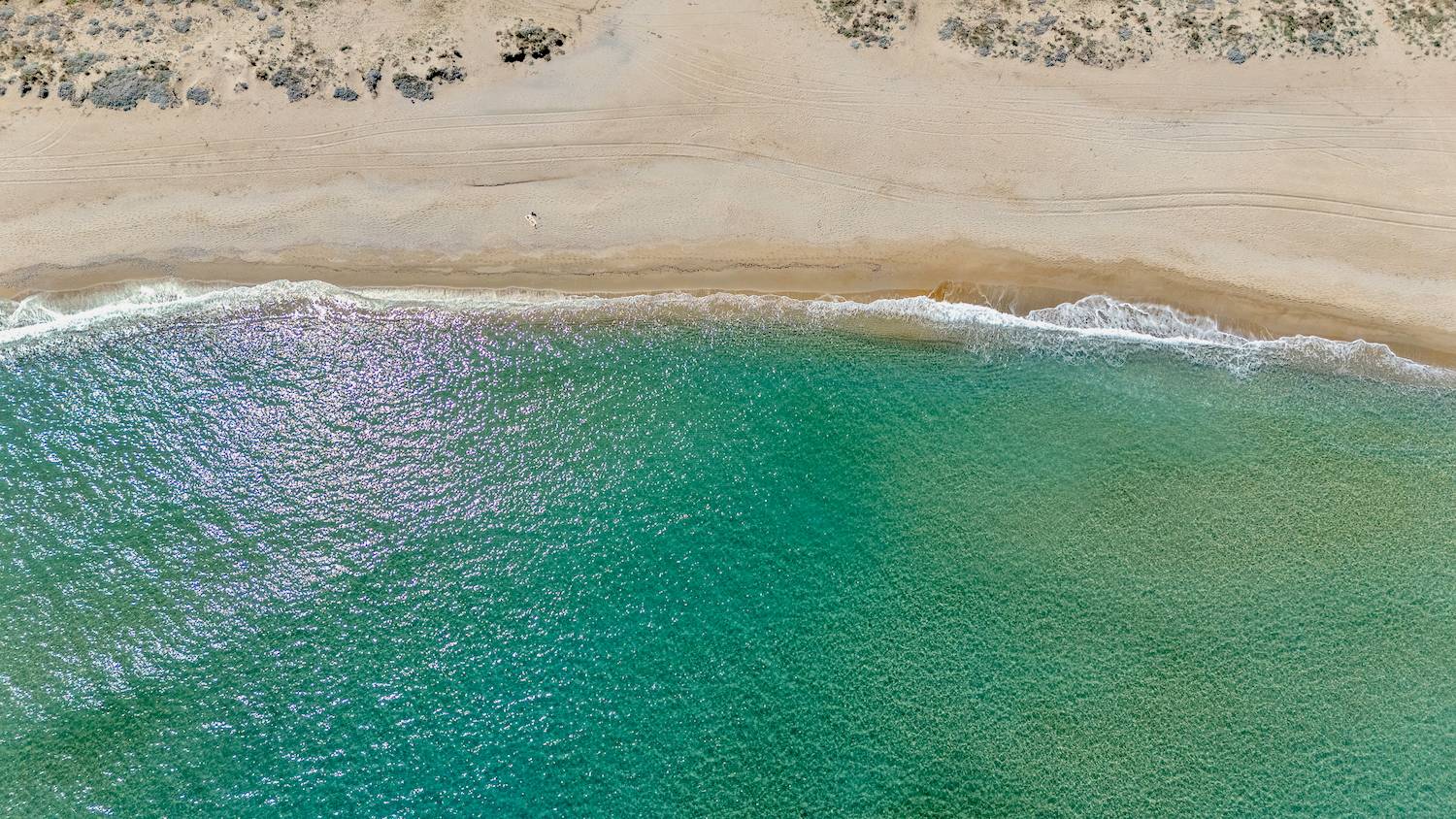 Sandy beach with turqoise waters in Crete, Greece