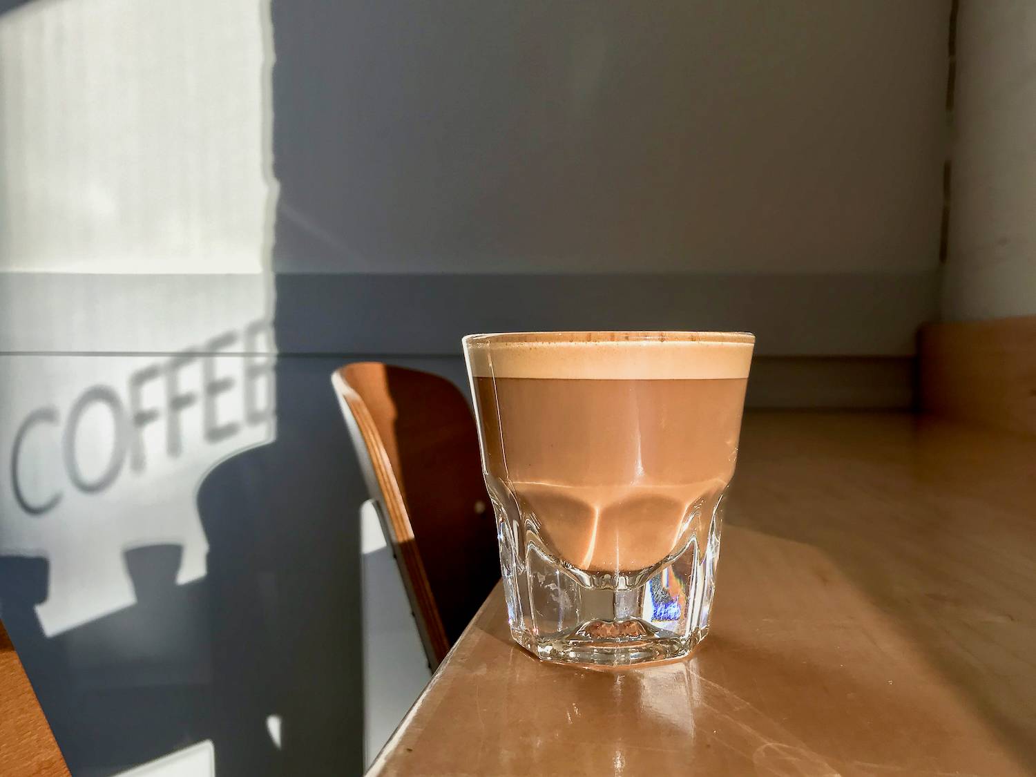 Glass of cortado in one of Minneapolis' hip coffee shops