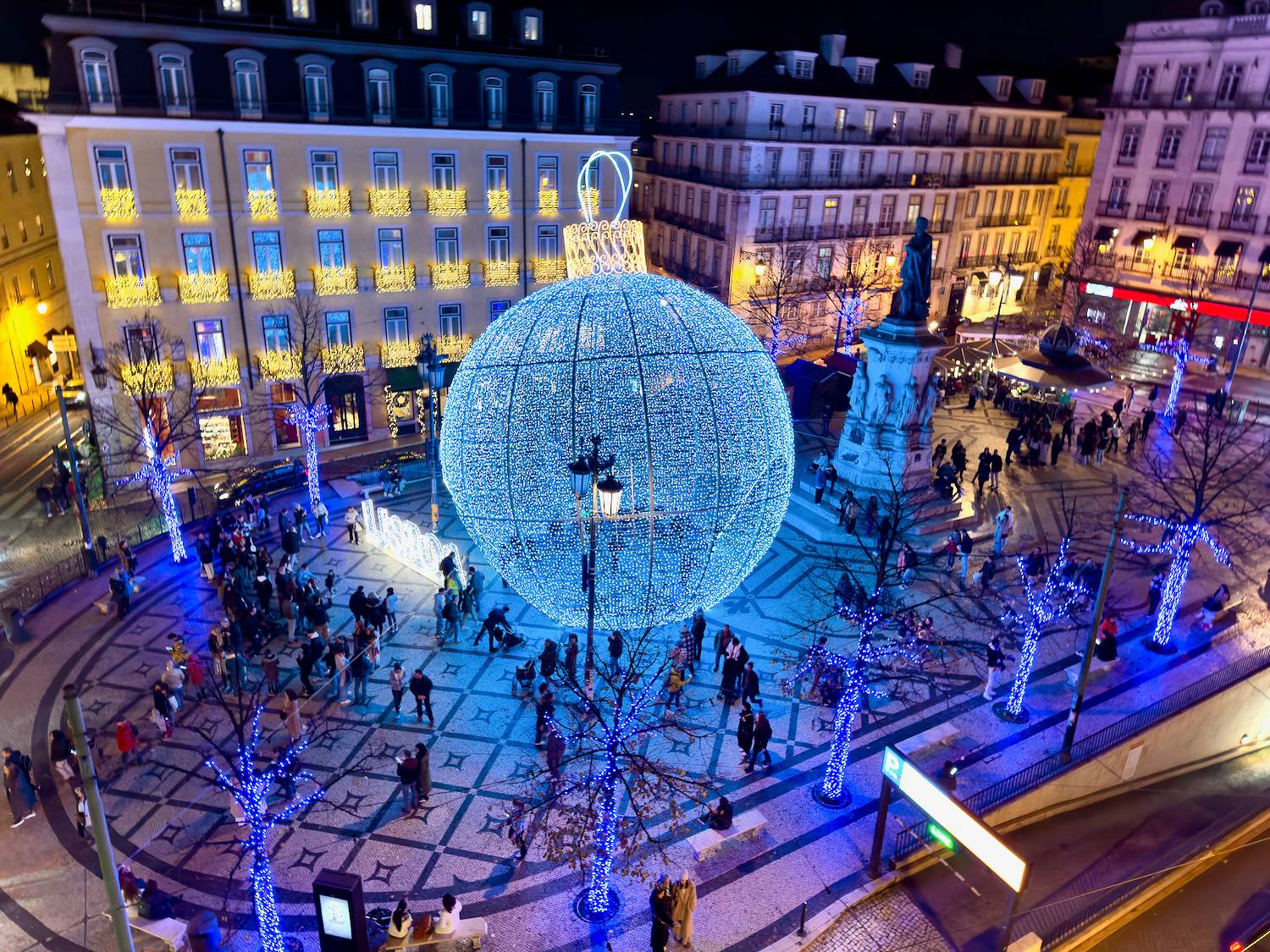 Christmas lights and decorations gleam all over Europe's Christmas markets, like in this central square in Lisbon, Portugal