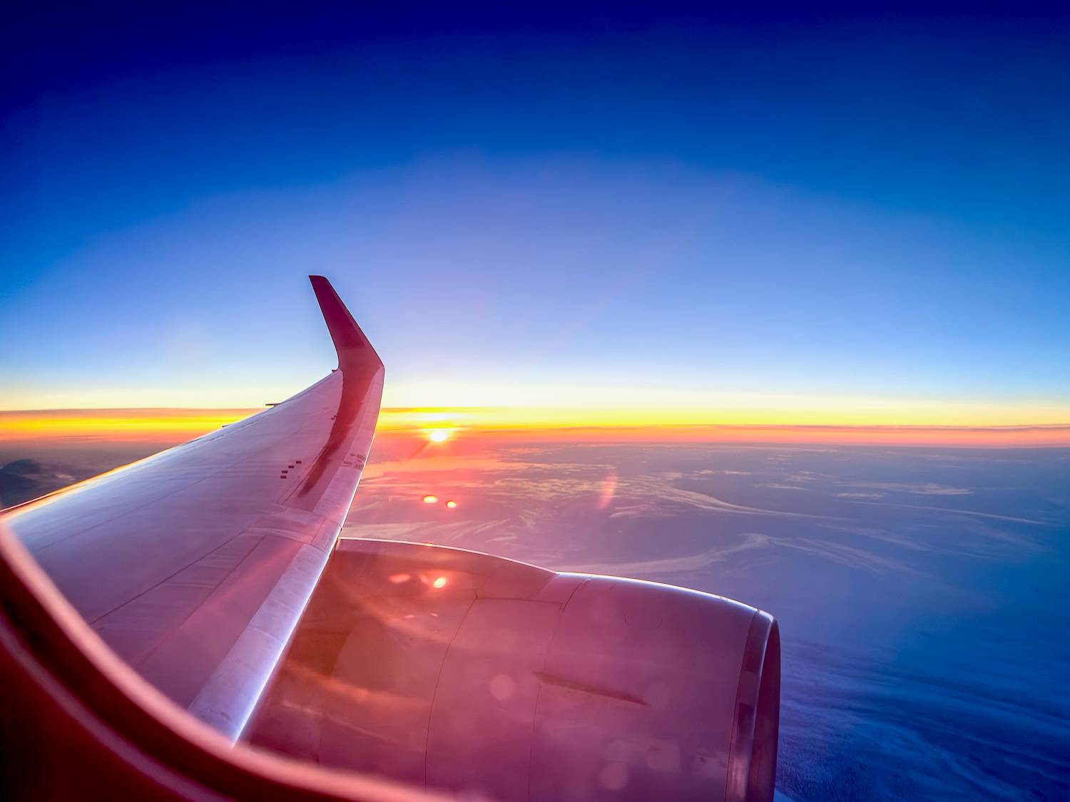 Sunset as viewed from the window of a plane
