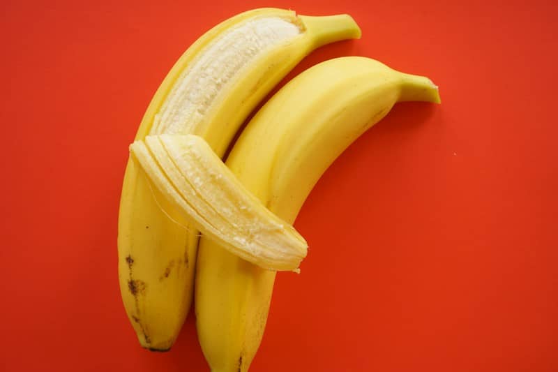 yellow banana fruit on red table