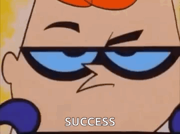 A gif of Dexter from Dexter's Lab smiling as he puts on sunglasses. The image is captioned "SUCCESS"