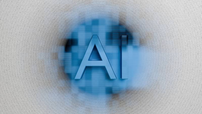 The letters ai are displayed on a blurred background.