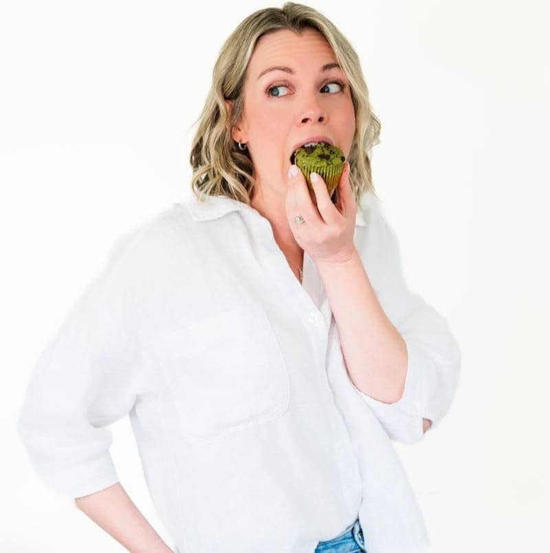 Taesha, the founder of The Natural Nurtuer, eating a veggie-loaded muffin.