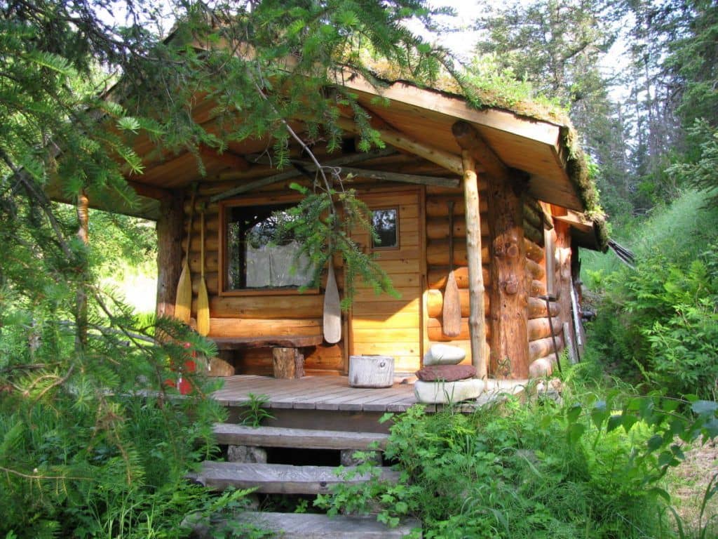 Front view of the log-cabin sauna at Loonsong Lake Lodge in Alaska.