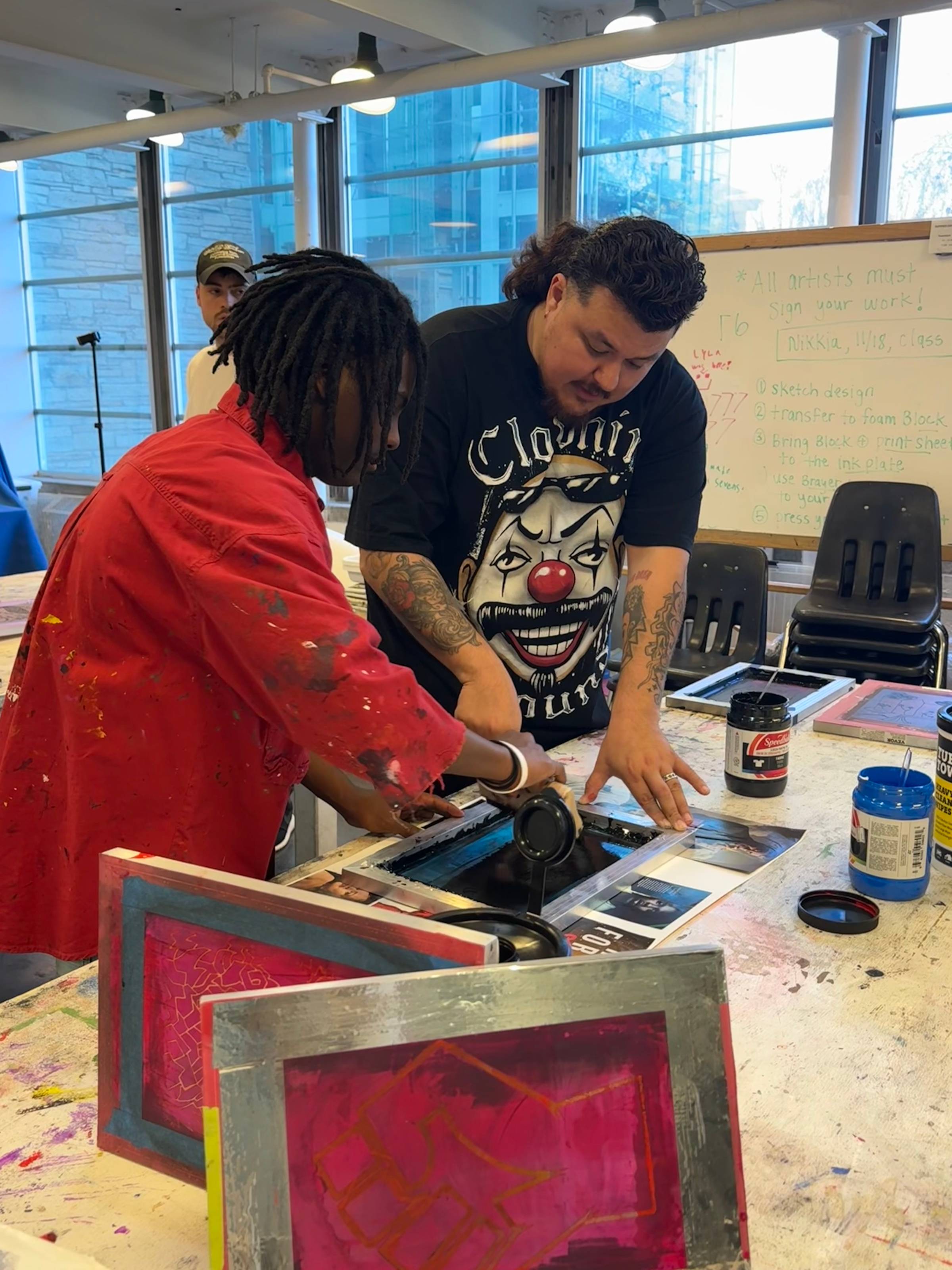 Siri working on a print with a student