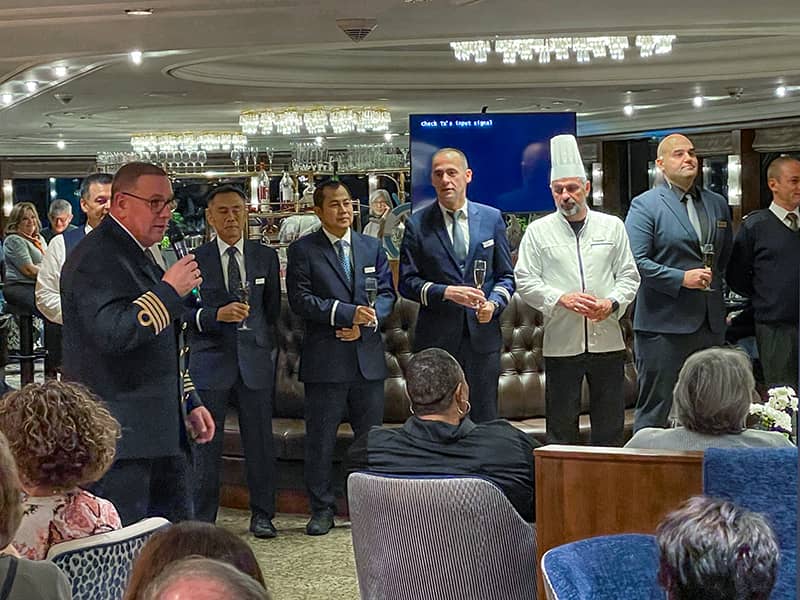 ship officers with champagne glasses on a Tauck tour