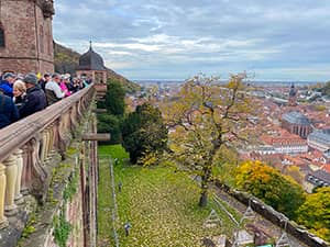 people on a balcony looking down on a city