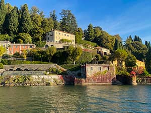 villas on a hillside above a lake