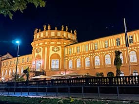 a bright yellow building at night seen on a Tauck tour