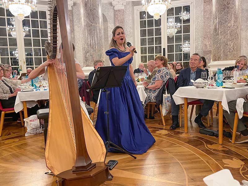a woman singing on a Tauck tour