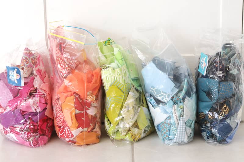 Bags of colourful quilting scrap fabrics 
