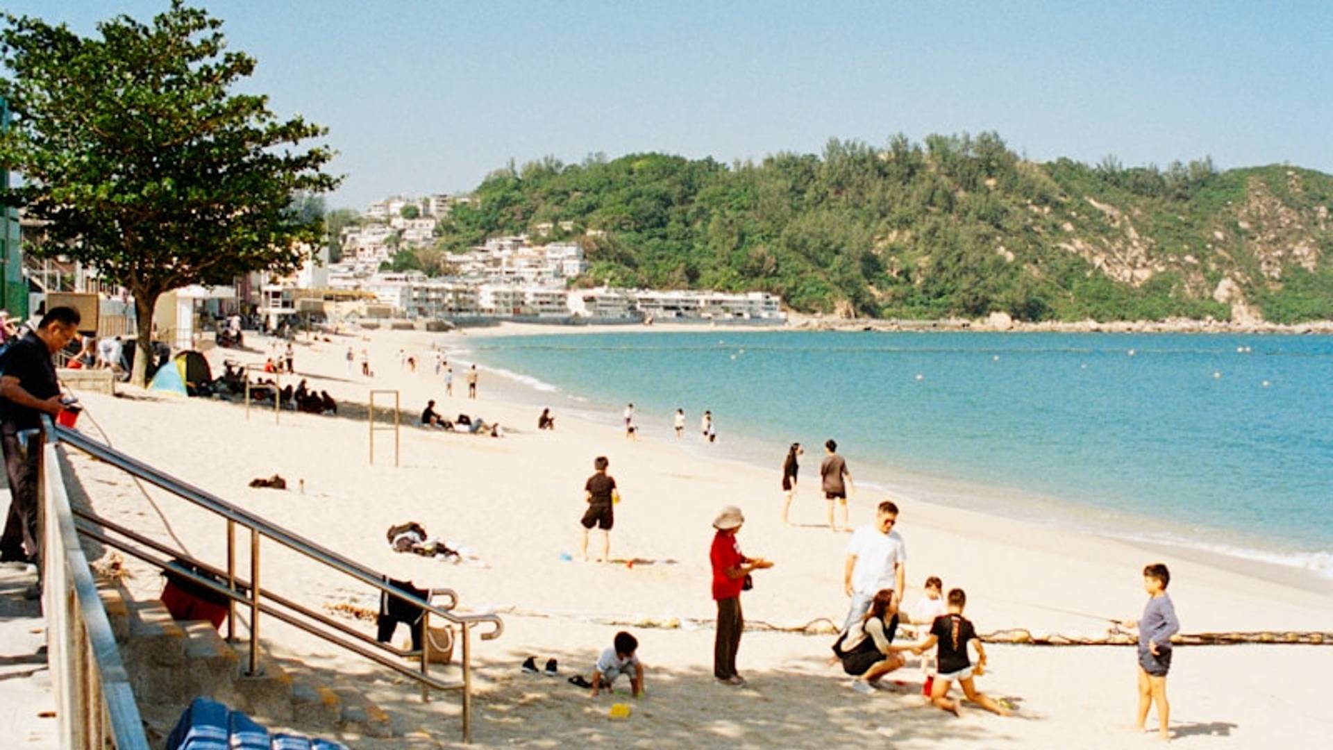 People enjoying a sunny day at the beach.