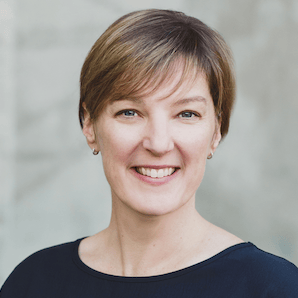 Beth Cougler Blom headshot; she has short straight brown hair and a warm smile