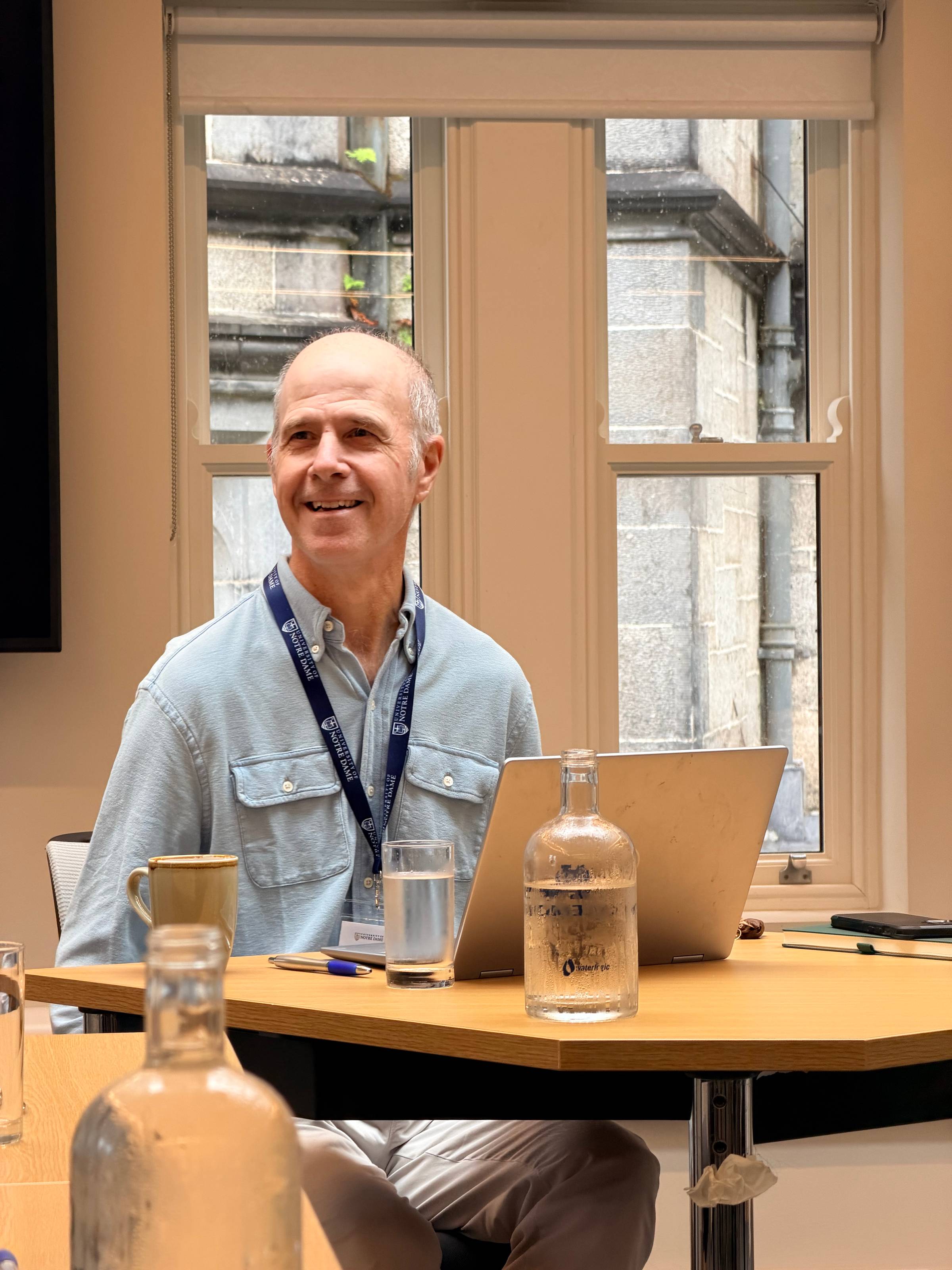 James Lang smiles at the group as he facilitates the writing workshop