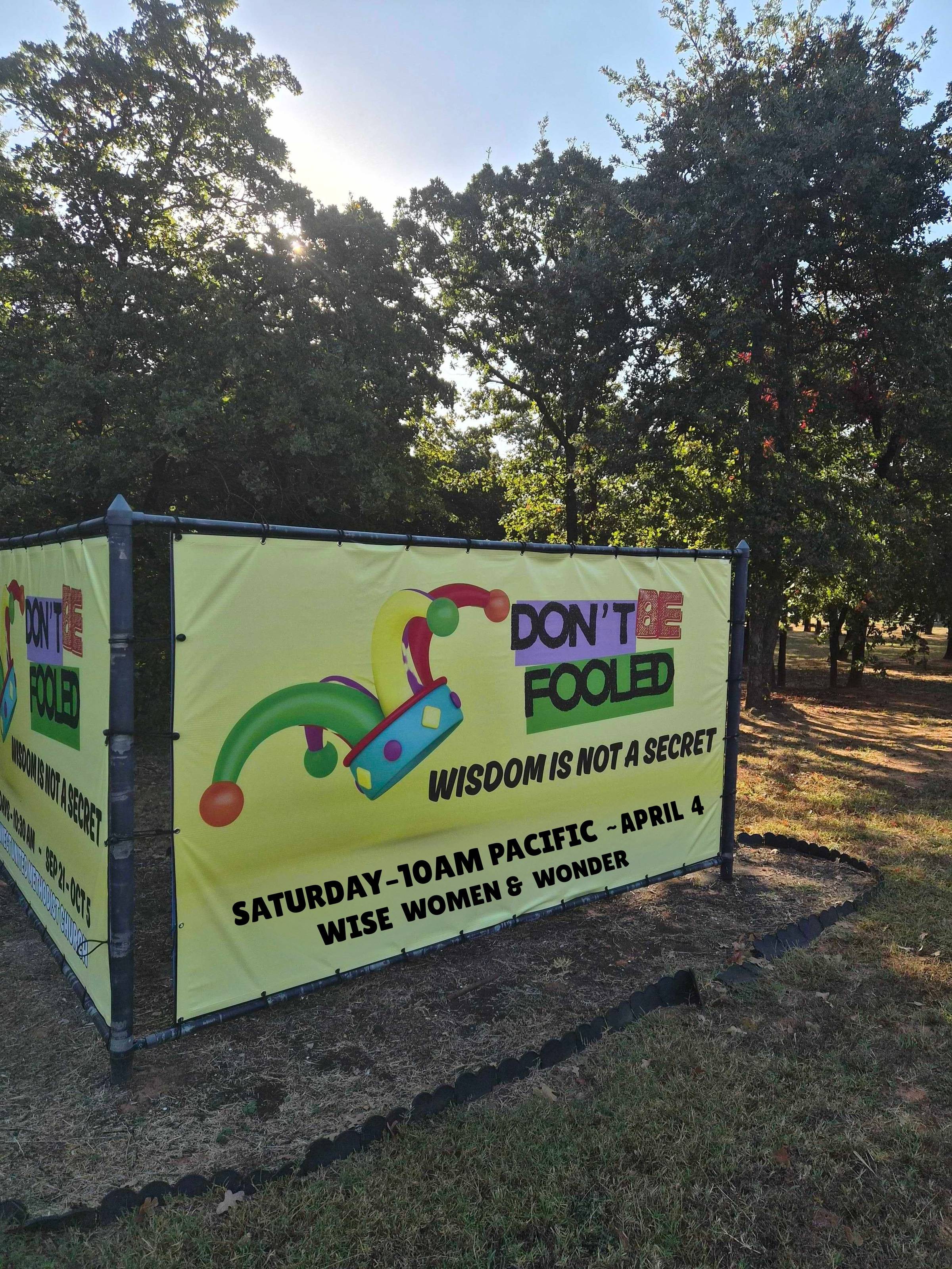 Billboard saying Don't Be Fooled: Wisdom is not a secret. Info about Wise Women and Wonder on April 4th