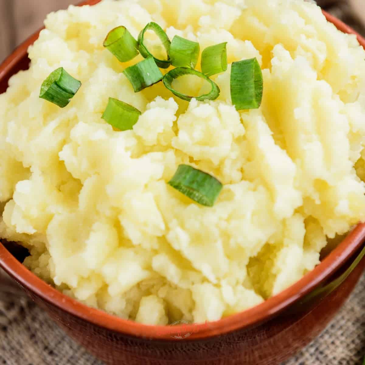 mashed potatoes with chive garnish.