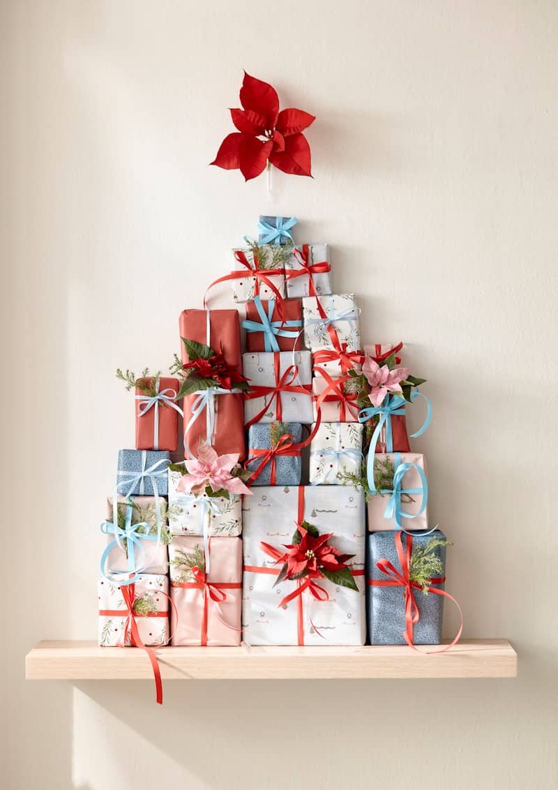 A christmas tree made out of wrapped presents