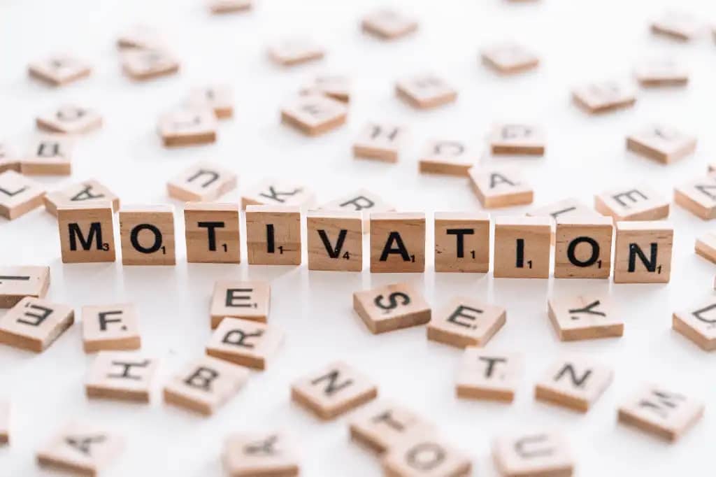 The word "MOTIVATION" spelled out using the tiles from the game Scrabble 