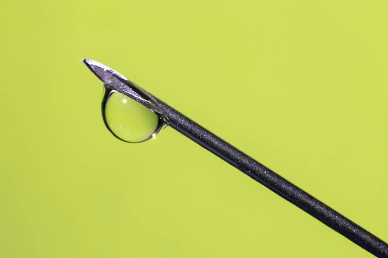 Liquid drop hanging from a medical needle tip