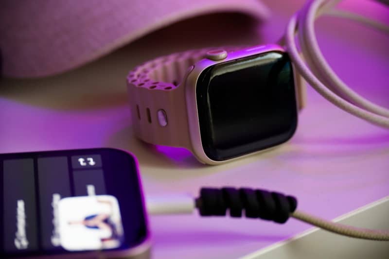 Smartwatch charging with a phone and cable