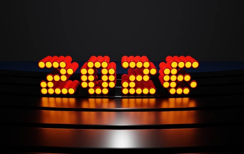 Glowing 2026 numbers on a dark reflective surface.
