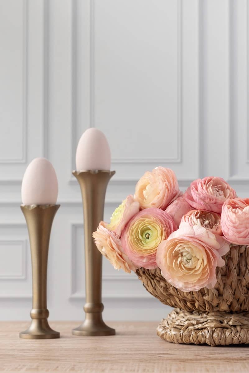 Flowers, eggs, and golden accents, a lovely arrangement.