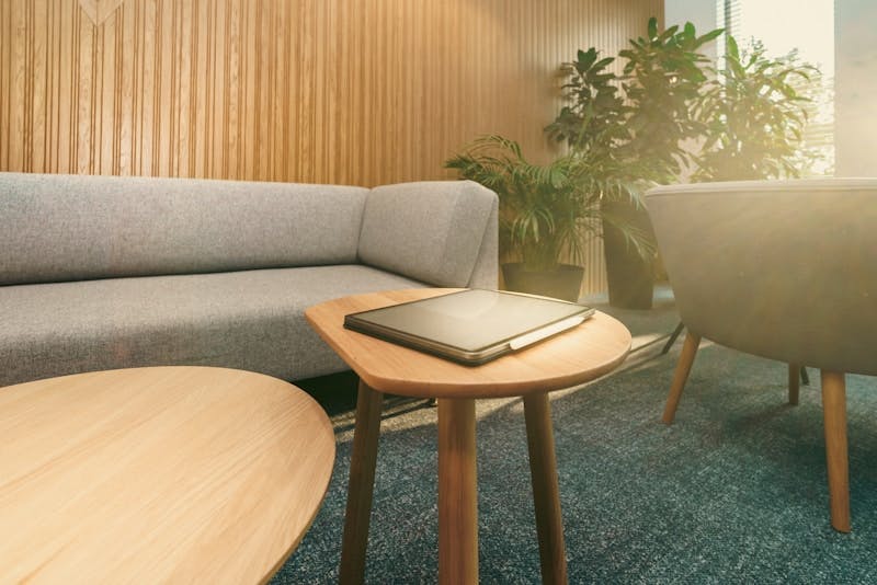 A living room with a couch and a table