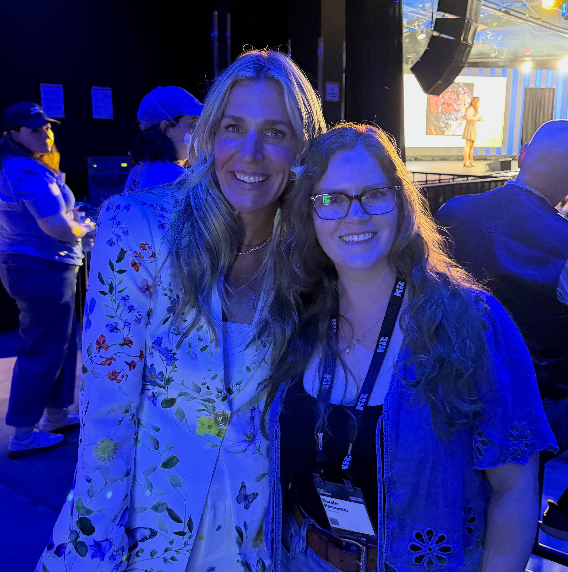 Natalie and Nicole Burke pictured in a convention hall.
