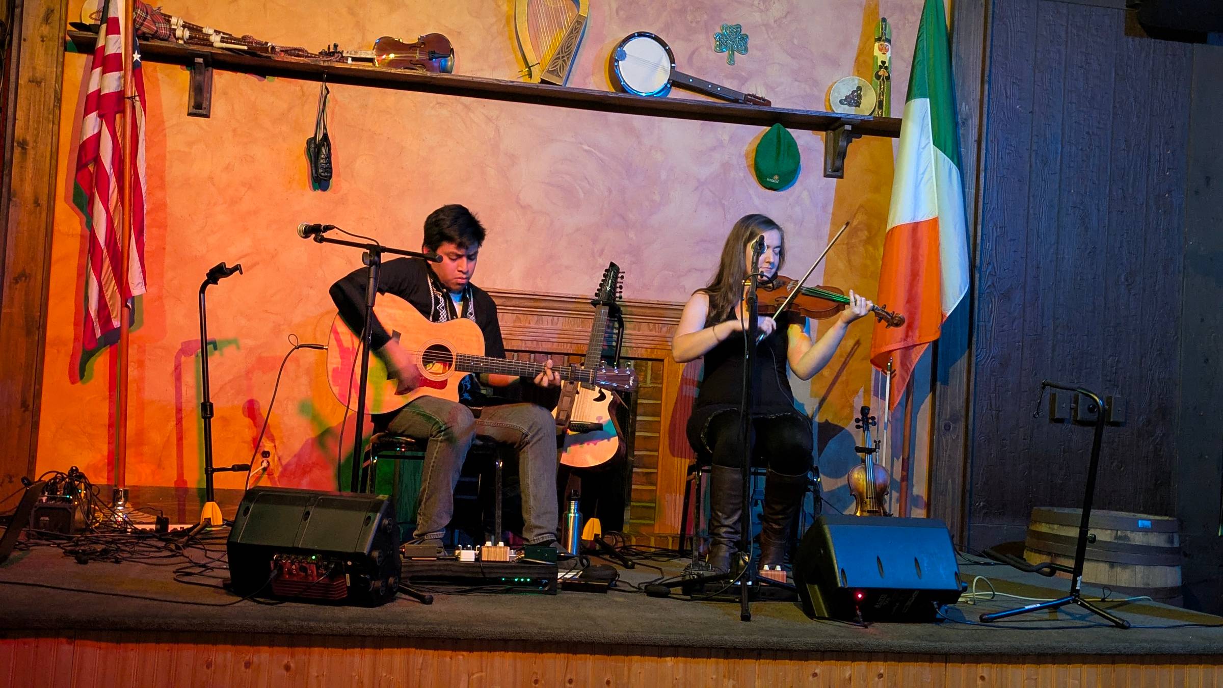 Bear Whitmer and Hannah Harris playing on stage at the Gaelic League