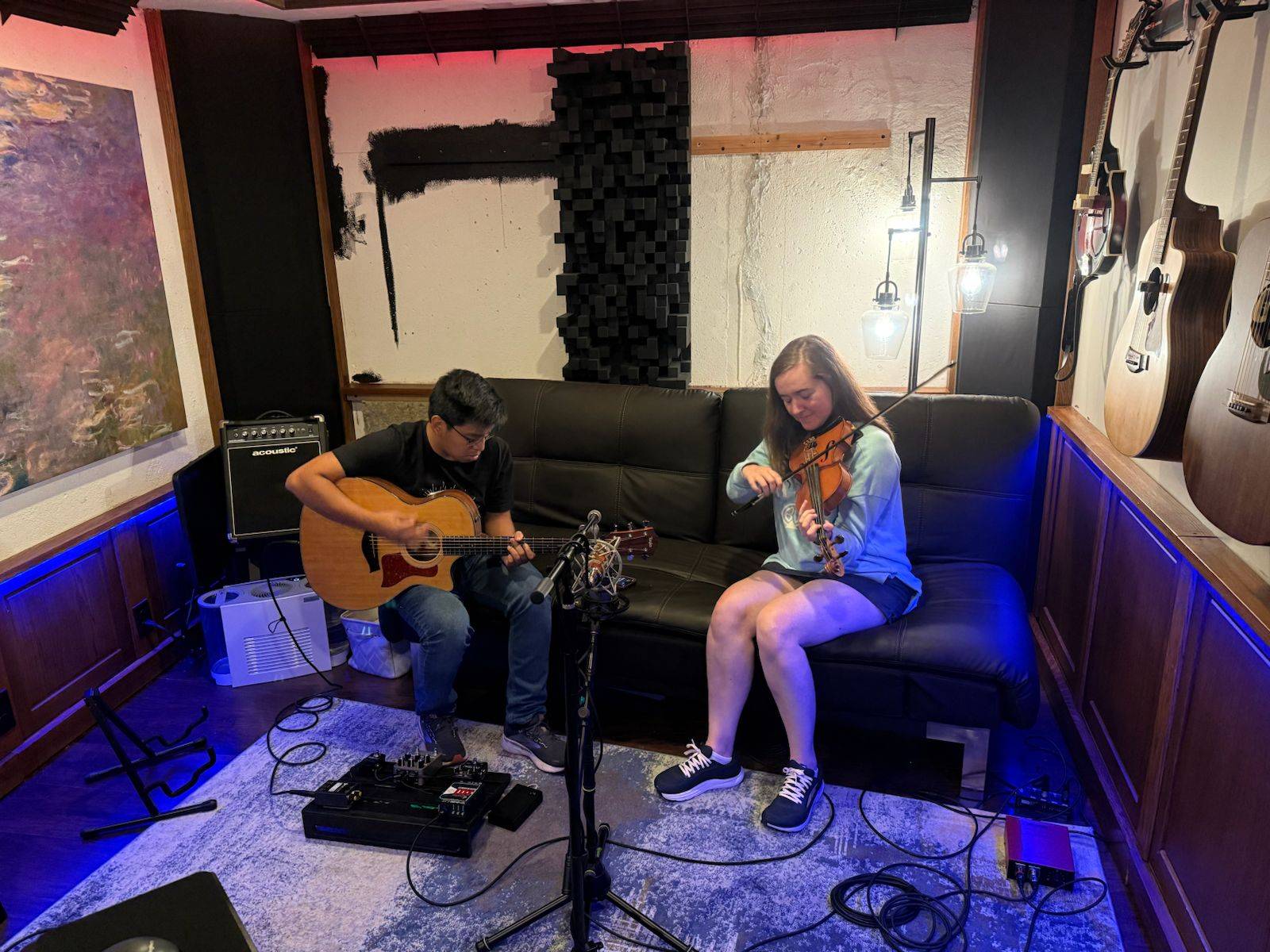 Alberto Whitmer and Hannah Harris playing in a friend's recording studio