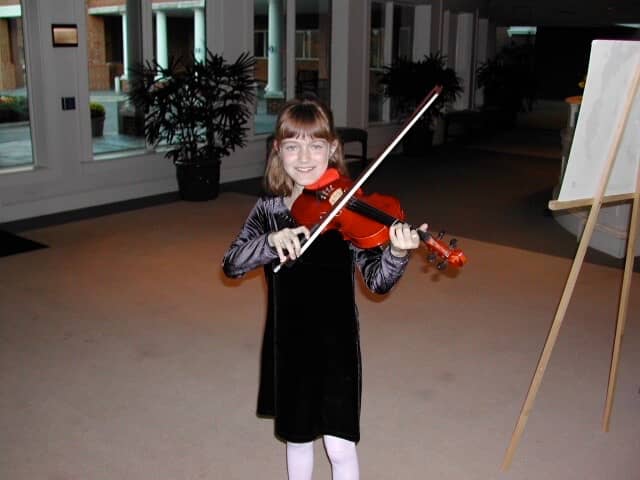 Young Hannah at one of her early Suzuki Recitals
