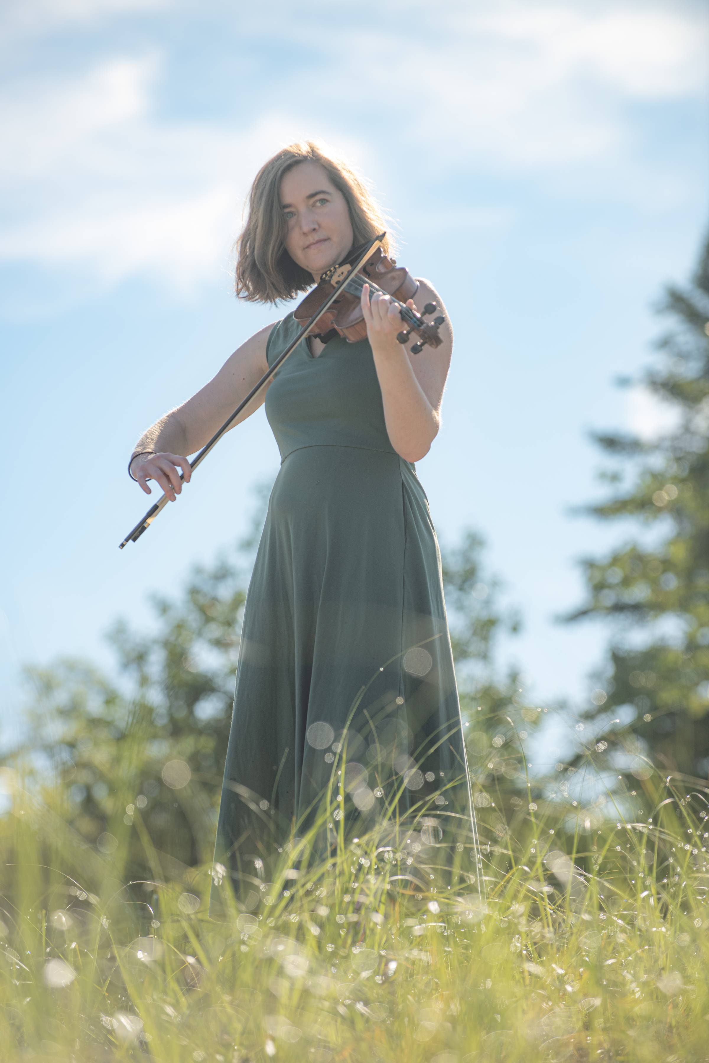 Hannah playing her fiddle among the dunes at Petoskey State Park