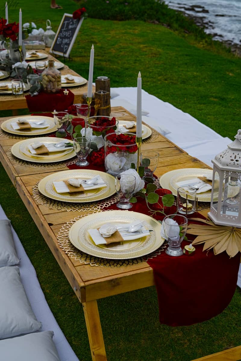 a long table set up with place settings and place settings