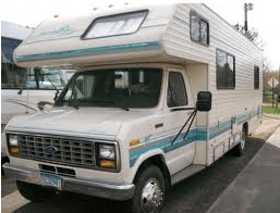 over the cab RV motorhome with blue stripes on the side