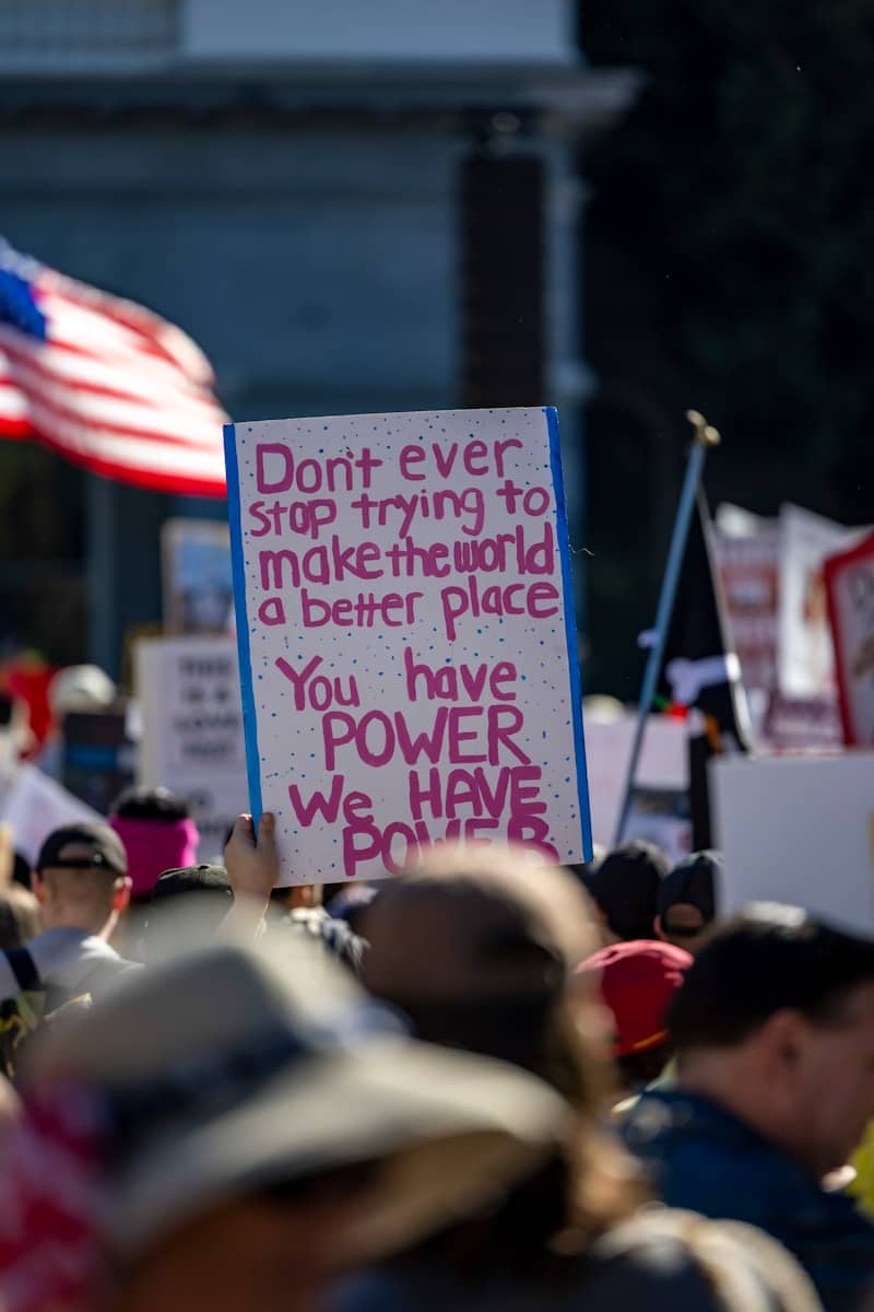 Protest sign reads "you have power we have power"