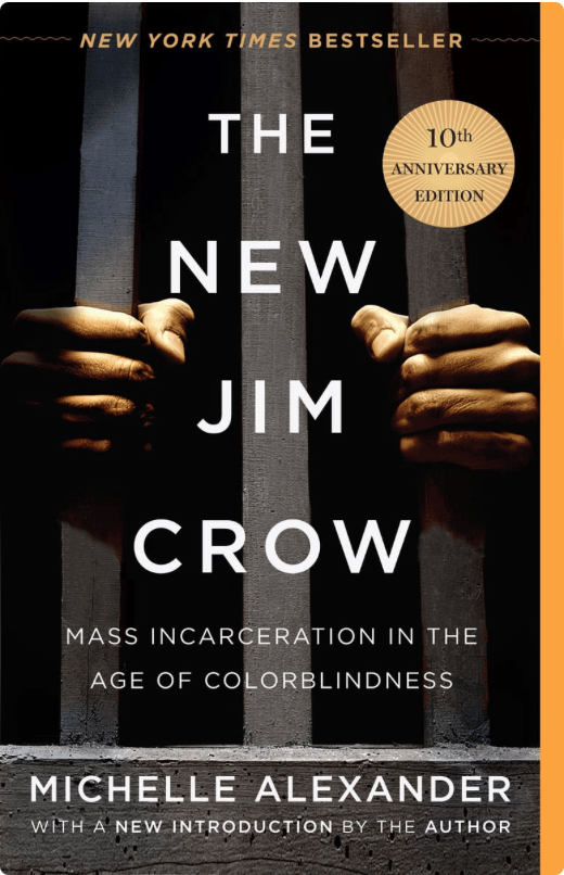 cover of The New Jim Crow in white text. In background are two hands grasping prison rails