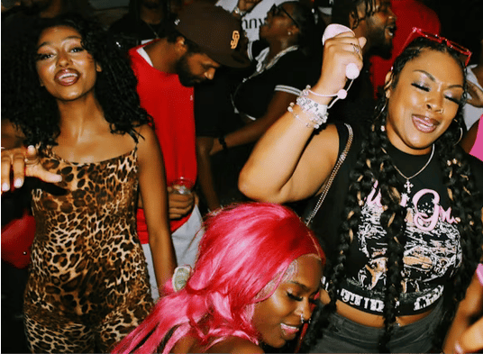 photo of 3 Black girls dancing in a club 
