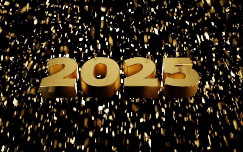 A golden new year date sign on a black background