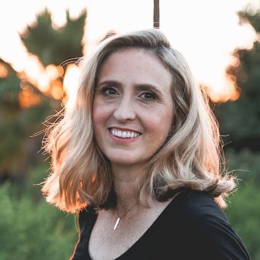 smiling woman in shallow focus photography