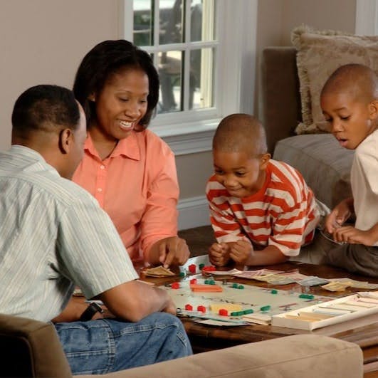 family playing board games