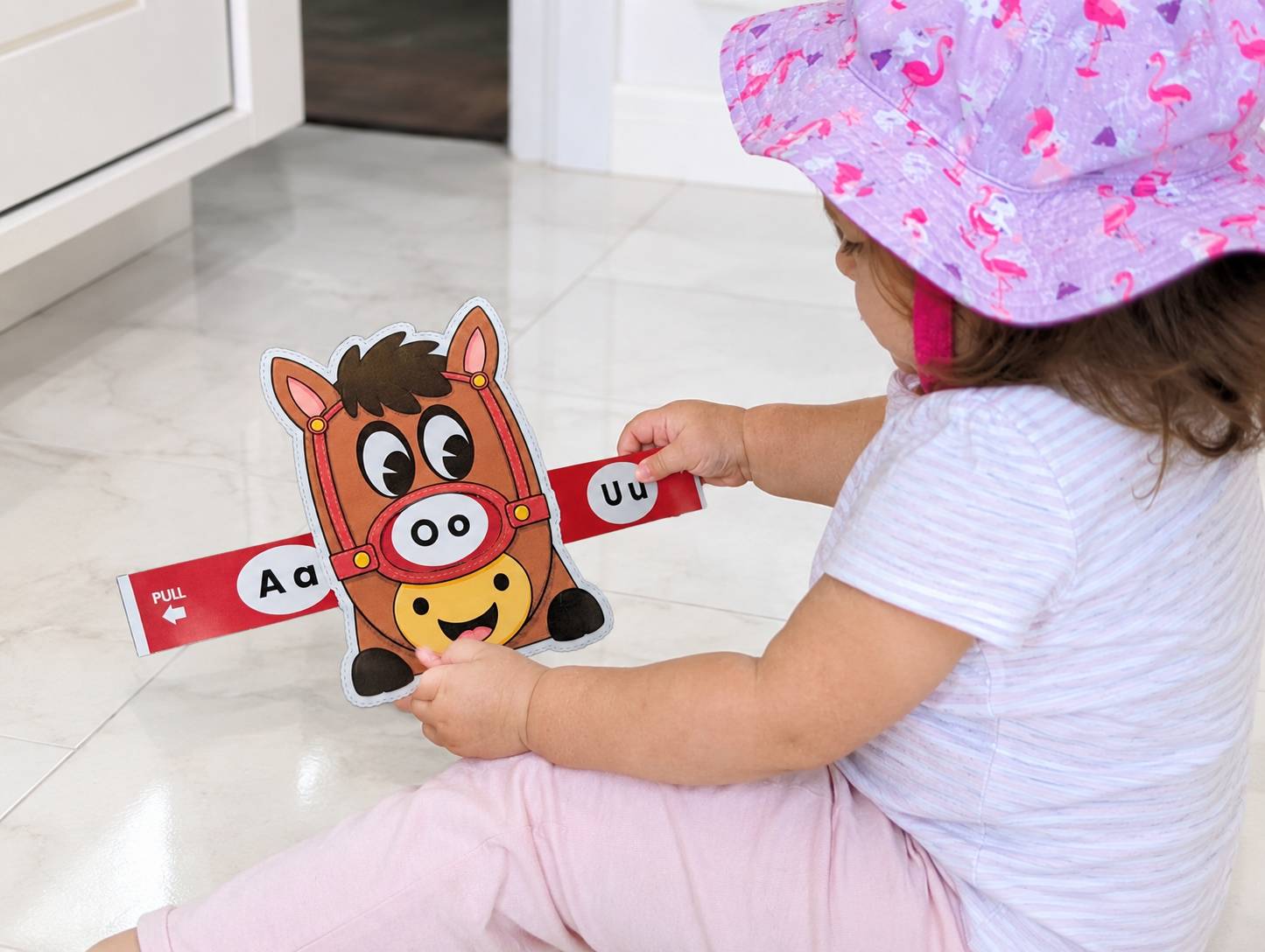 Toddler playing with the RBK Horse Sound Slider