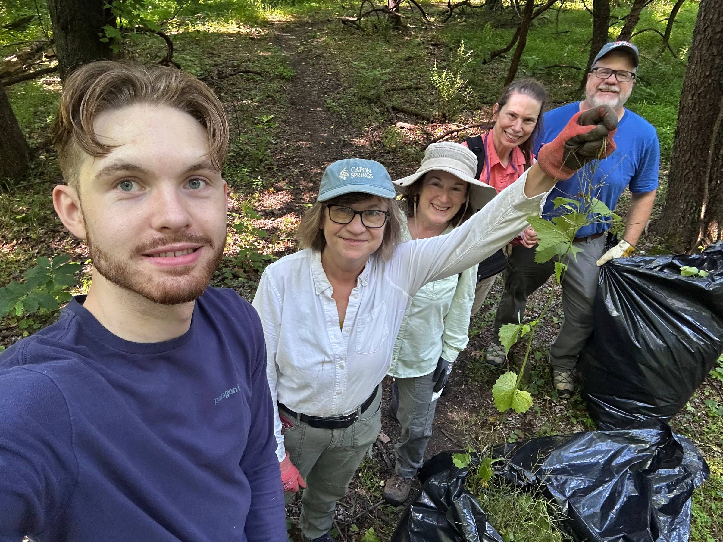 Volunteers pose during garlic mustard pull