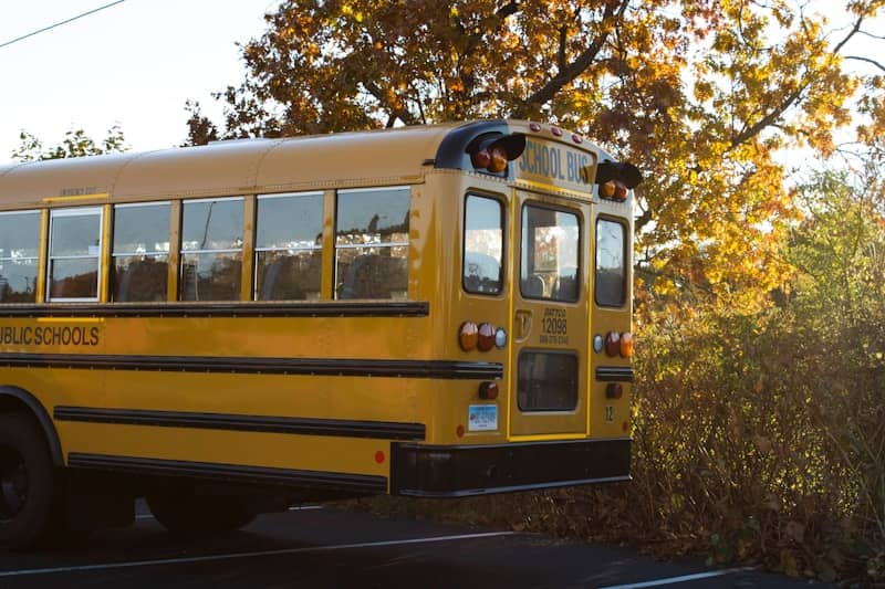 a yellow school bus parked in a parking lot