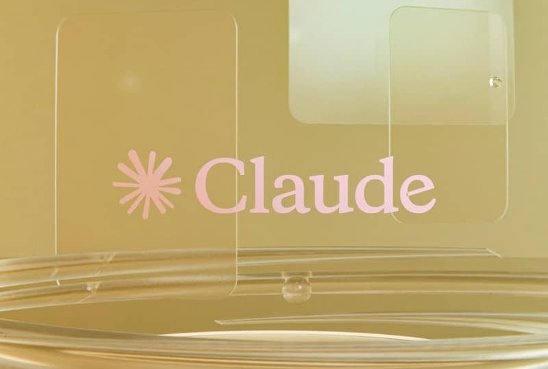 Pink claude logo on a golden background with clear elements.