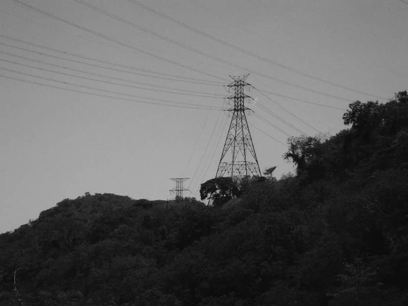 Power lines stretch across a hilly landscape