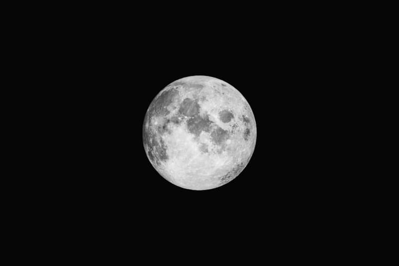 Full moon glowing in the dark night sky