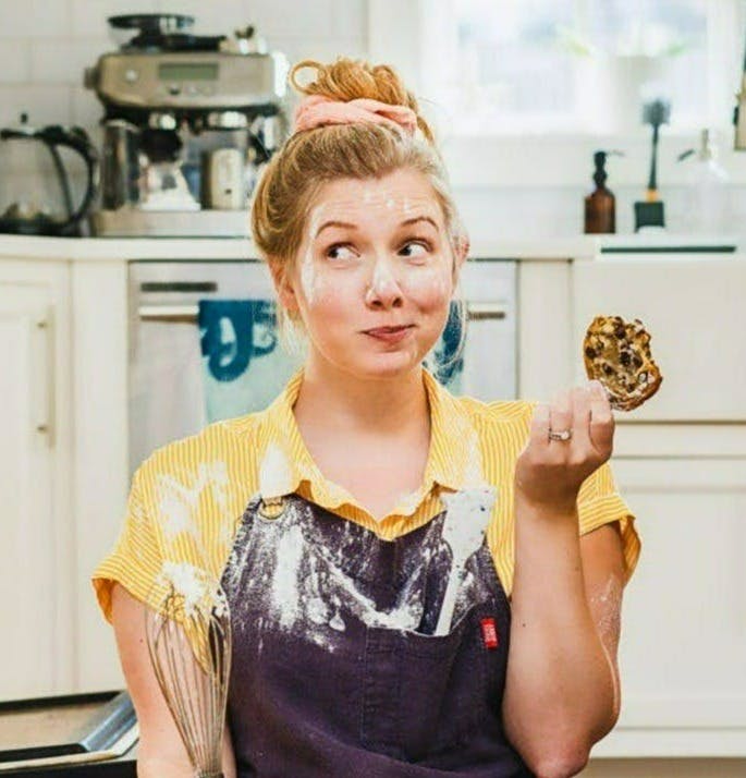 Leslie Kiszka on the floor of her kitchen being goofy