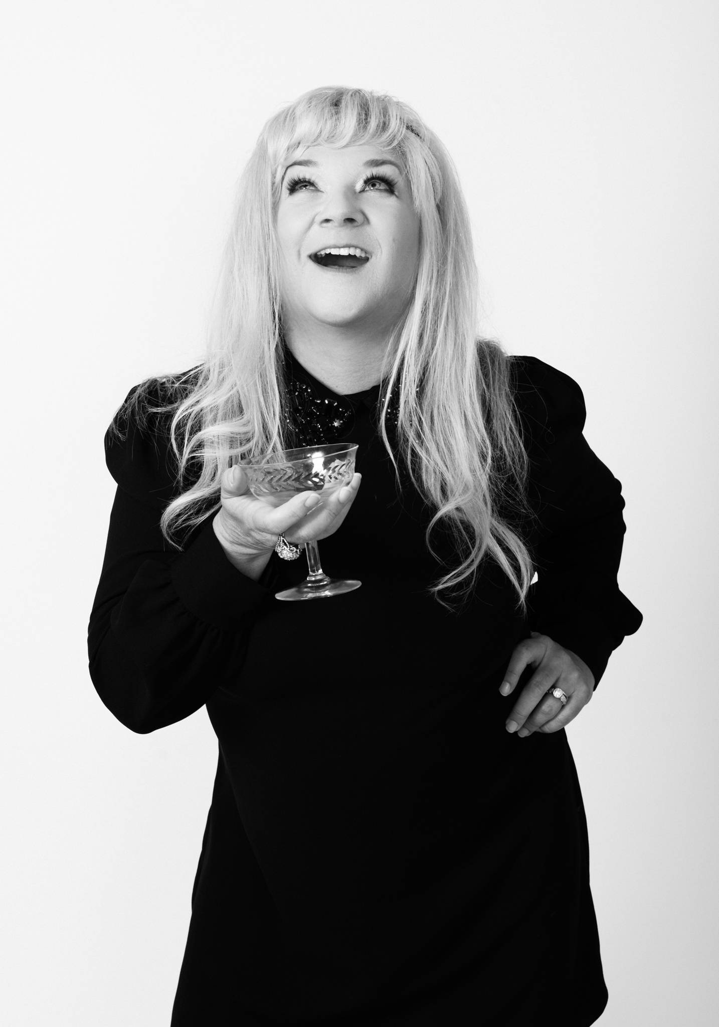 Happy blonde woman with champaign glass