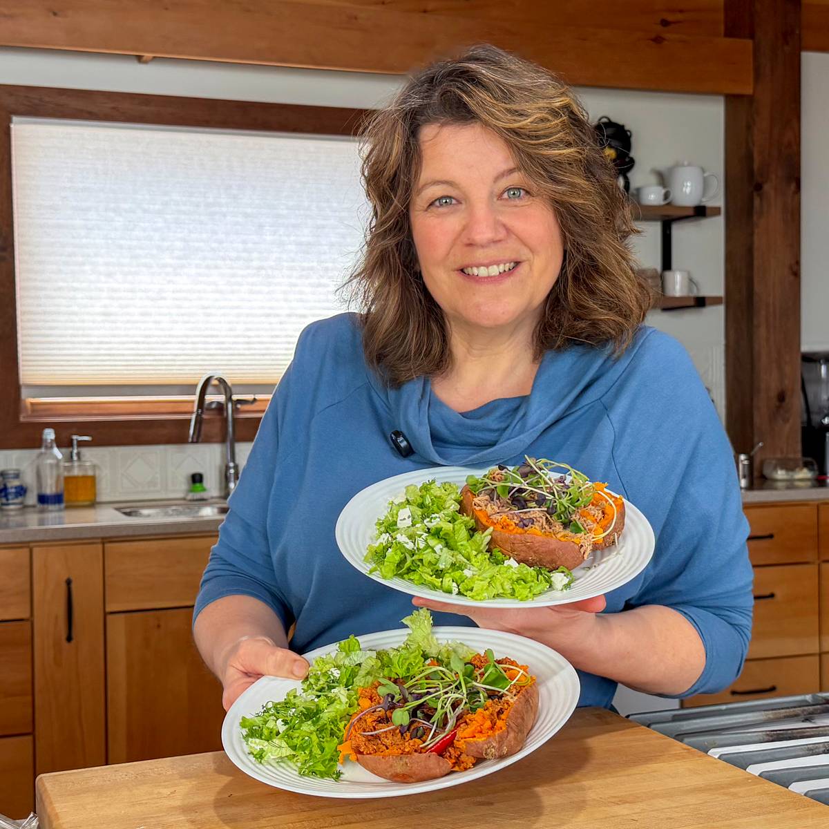 tuna stuffed sweet potato with green salad held by getty stewart 